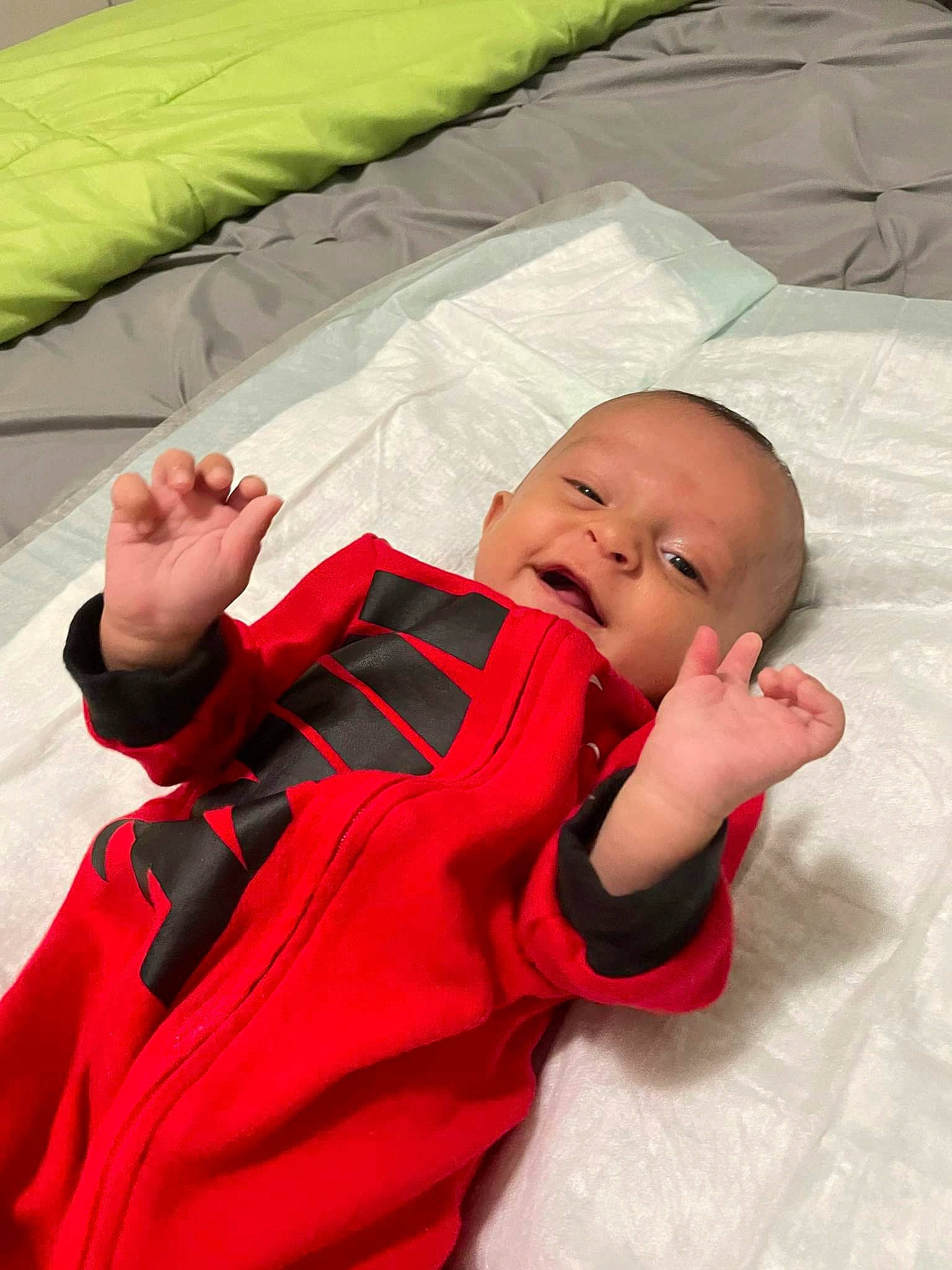 River is registered to the contest to win money with this photo: baby, baby_products, baby_sleeping, baby_toddler_clothing, bedtime, carmine, child, comfort, facial_expression, finger, fun, happy, linens, person, room, sitting, skin, sleeve, textile, thumb