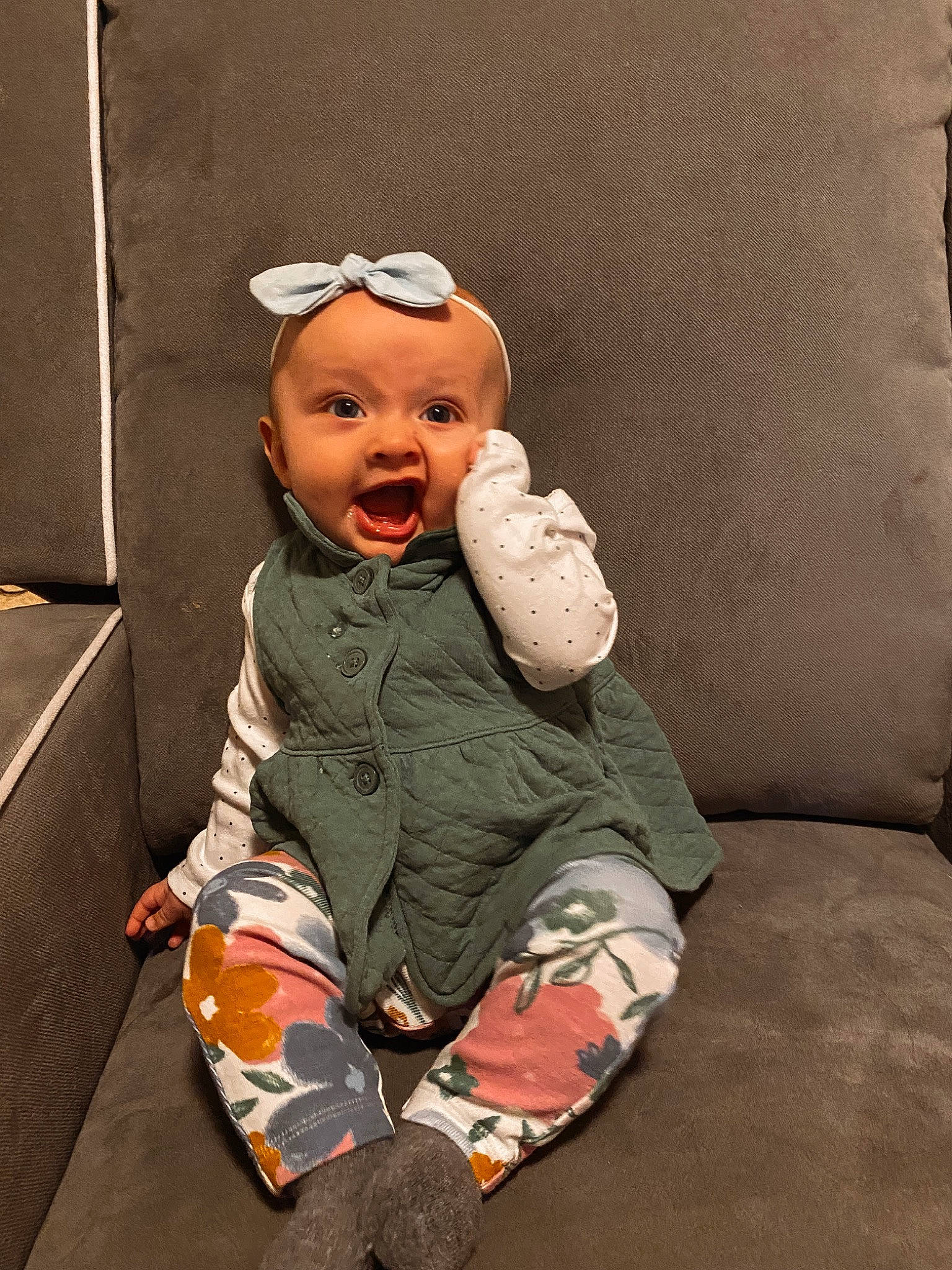 Aspen joined the competition — help win amazing prizes! baby, baby_toddler_clothing, child, comfort, face, finger, flooring, foot, fun, gesture, happy, hat, headgear, knee, leg, person, personal_protective_equipment, sleeve, thigh, toddler
