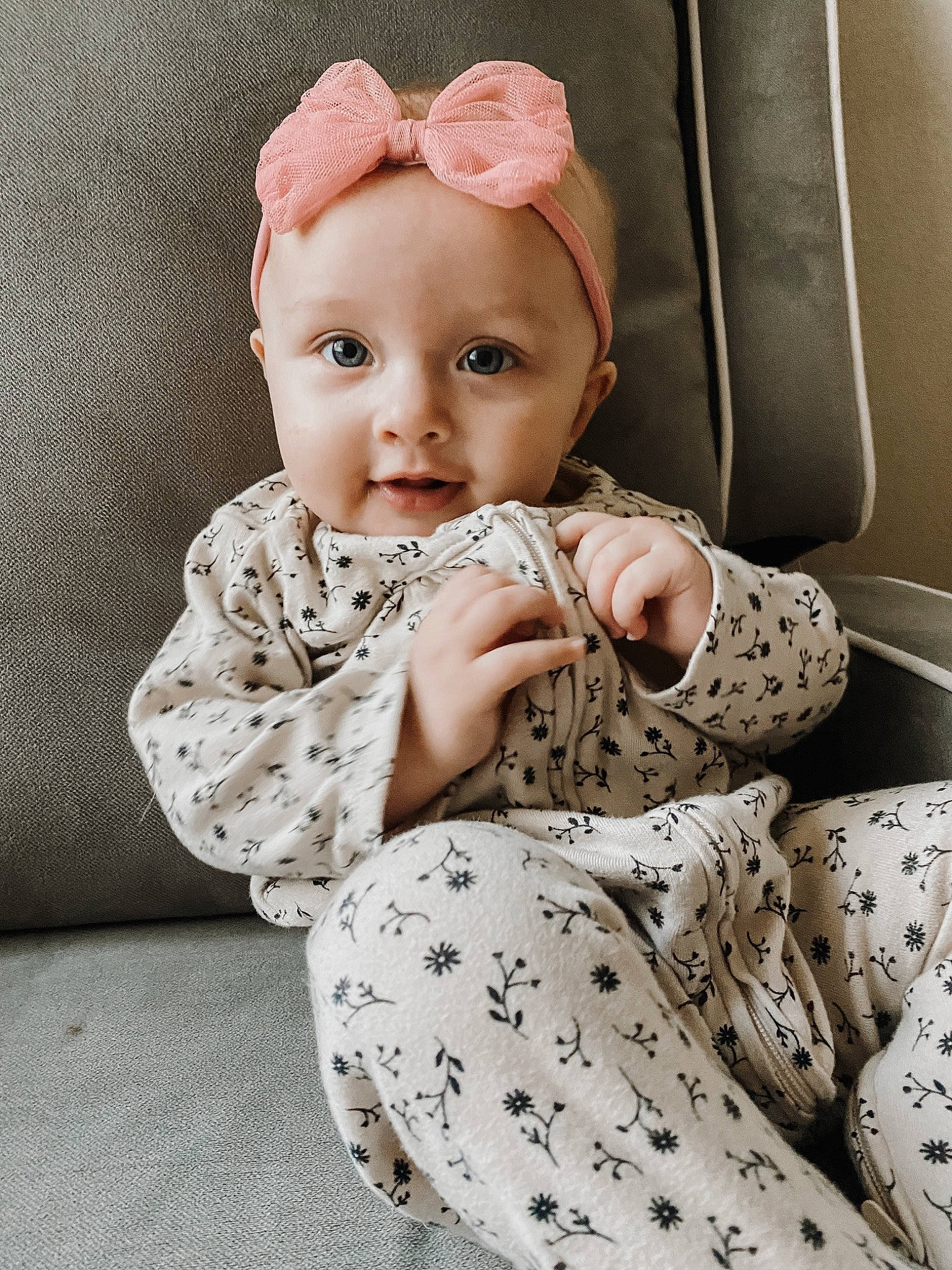 Aspen is registered to the contest to win money with this photo: baby, baby_toddler_clothing, cheek, child, collar, comfort, dress, fashion_accessory, headgear, linens, lip, outerwear, pattern, person, pink, product, sitting, skin, sleeve, textile
