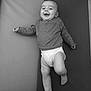 Léo participe au concours pour gagner de l'argent avec cette photo : baby, infant, smiling, laughing, sweater, diaper, lying_down, mat, soft_surface, cute, child, happy, one_person, indoors, monochrome, black_and_white, playful, chubby_legs, portrait, casual_clothing
