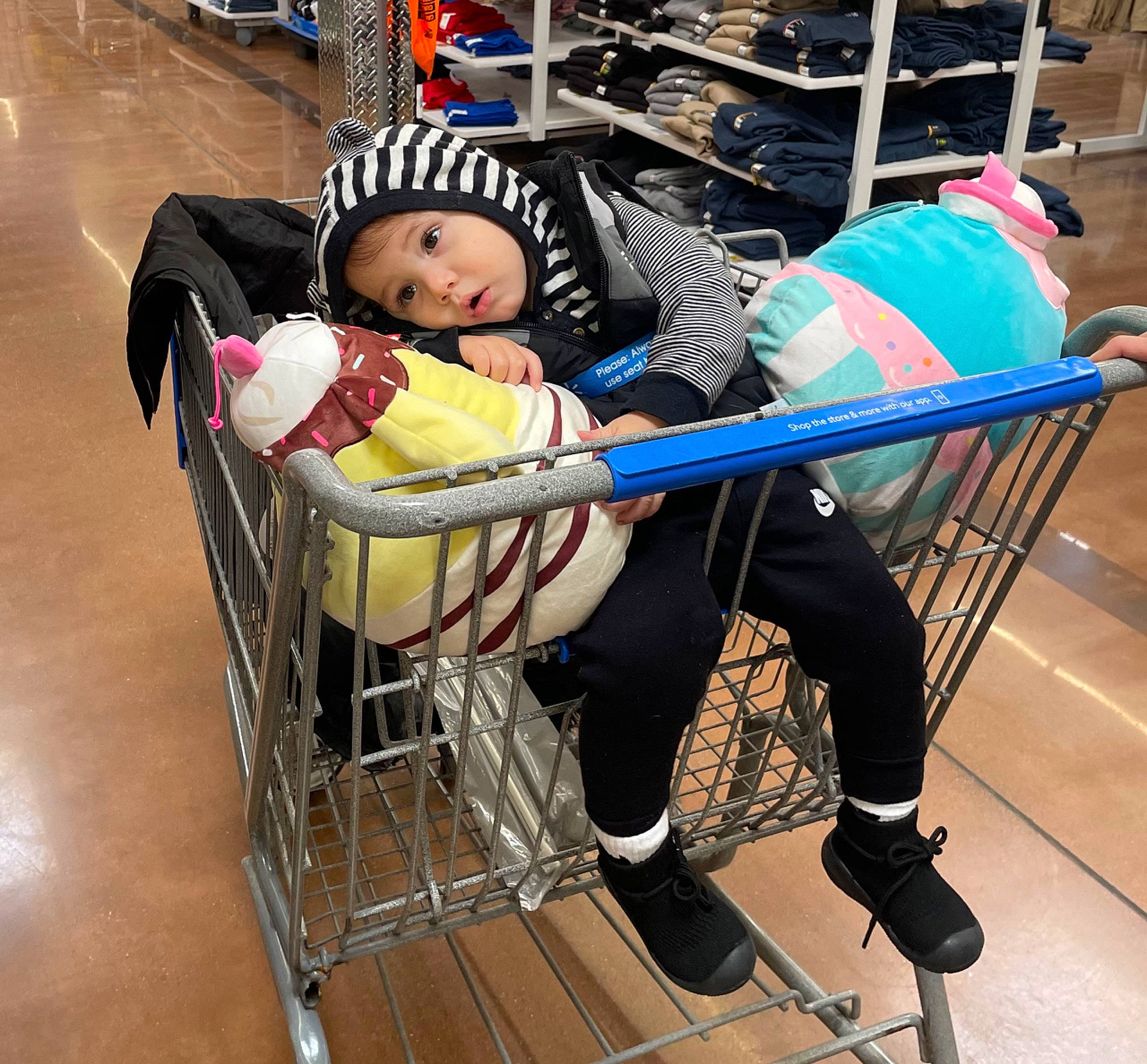 Kash is registered to the contest to win money with this photo: baby, baby_carriage, baby_products, baby_safety, cart, child, cleanliness, electric_blue, fun, headwear, leisure, person, service, shopping_cart, sitting, surprise, tire, toddler, vehicle, wheel