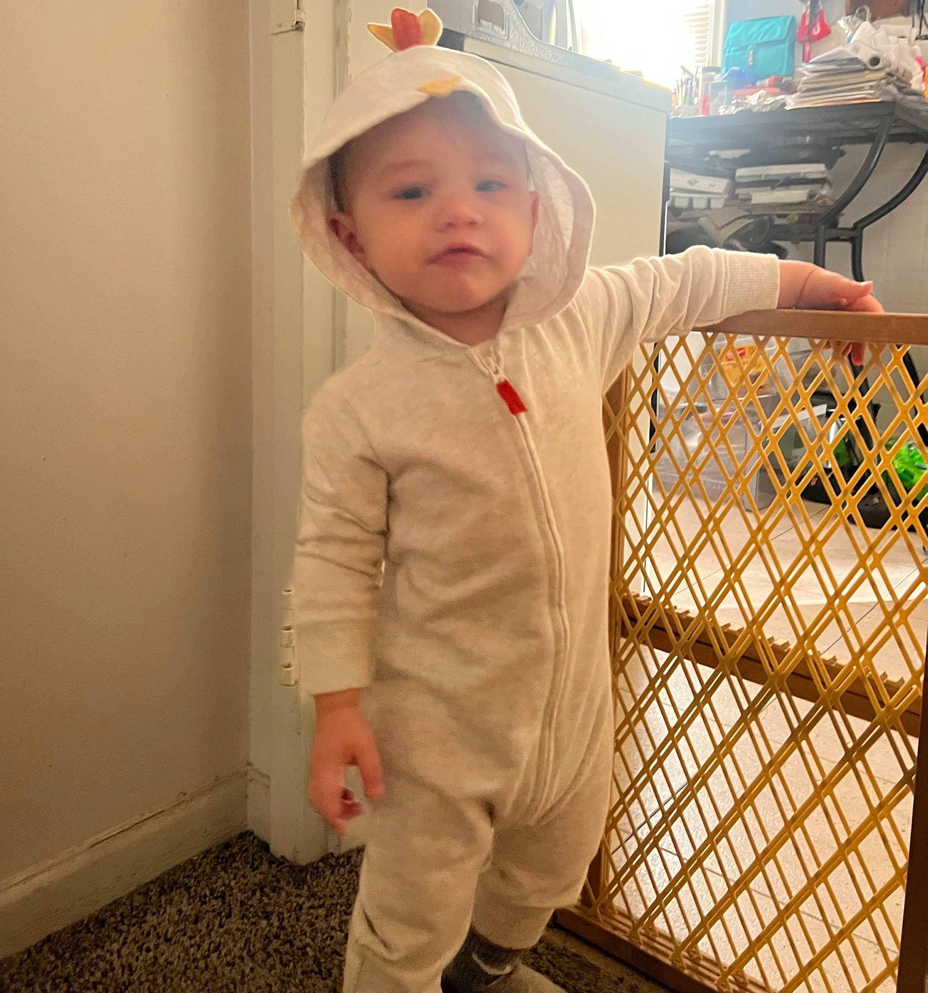 Kash joined the competition — help win amazing prizes! baby, baby_safety, baby_toddler_clothing, cap, child, eye, face, fence, flooring, fun, gesture, happy, head, headwear, human_body, nose, person, room, sleeve, standing