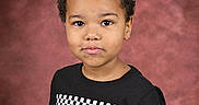 Jeremy joined the competition — help win amazing prizes! black, black_tshirt, casual_clothing, child, colorful, curly_hair, eyes, face, indoor, lightning_mcqueen, photography, portrait, red, short_sleeves, smile, standing, studio_background, tshirt, yellow, young_boy
