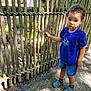 Jeremy joined the competition — help win amazing prizes! child, toddler, blue_shirt, denim_shorts, wooden_fence, outdoor, daylight, curly_hair, shoes, pathway, nature, greenery, rope, standing, casual_clothing, expression, person, sunlight, shadow, summer