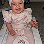 Aliyah joined the competition — help win amazing prizes! baby, child, smiling, headband, bow, pink_dress, tights, sitting, colorful_mat, rainbow, sun, cloud, indoor, carpet, cute, happy, portrait, person, infant, floor