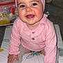 Aliyah is registered to the contest to win money with this photo: baby, child, smile, pink_bow, headband, pink_clothing, sitting, gray_socks, rainbow_pattern, play_mat, indoor, cute, happy, infant, portrait, hands, toes, carpet, face, eyes