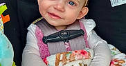 Oakley joined the competition — help win amazing prizes! baby, blanket, blue_eyes, bow, car_seat, chicco_logo, child, close_up, clothing, cozy, floral, hands, harness, headband, infant, pink, plush_toy, portrait, smile, stroller_accessory