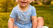 Oakley is registered to the contest to win money with this photo: baby, blanket, blue_outfit, child, cute, daylight, grass, greenery, happy, headband, nature, outdoor, pink_shoes, portrait, purple_bow, shoes, sitting, smiling, sunlight, toddler