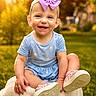 toddler, child, smiling, purple_bow, blue_outfit, pink_shoes, outdoor, sunlight, greenery, blanket, happy, portrait, cute, baby, grass, nature, sitting, daylight, headband, shoes