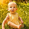 child, toddler, grass, outdoor, sunlight, yellow_dress, barefoot, greenery, summer, cute, baby, nature, sunshine, portrait, young_child, sitting, hair_bows, innocent, daylight, playful