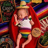 Zakariya joined the competition — help win amazing prizes! baby, infant, sleeping, sombrero, maracas, red_beanbag, colorful_blanket, cactus, sign, celebration, fiesta, cinco_de_mayo, one_month, decorations, mexican_theme, clothing, cute, holiday, festive, portrait