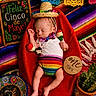 baby, infant, sleeping, sombrero, maracas, red_beanbag, colorful_blanket, cactus, sign, celebration, fiesta, cinco_de_mayo, one_month, decorations, mexican_theme, clothing, cute, holiday, festive, portrait