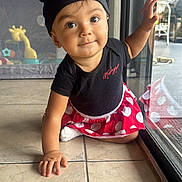 Antonella joined the competition — help win amazing prizes! toddler, child, baby, crawling, floor, window, glass_door, toy, playpen, indoor, clothing, minnie_mouse, hat, red, black, polka_dots, cute, face, eyes, hand