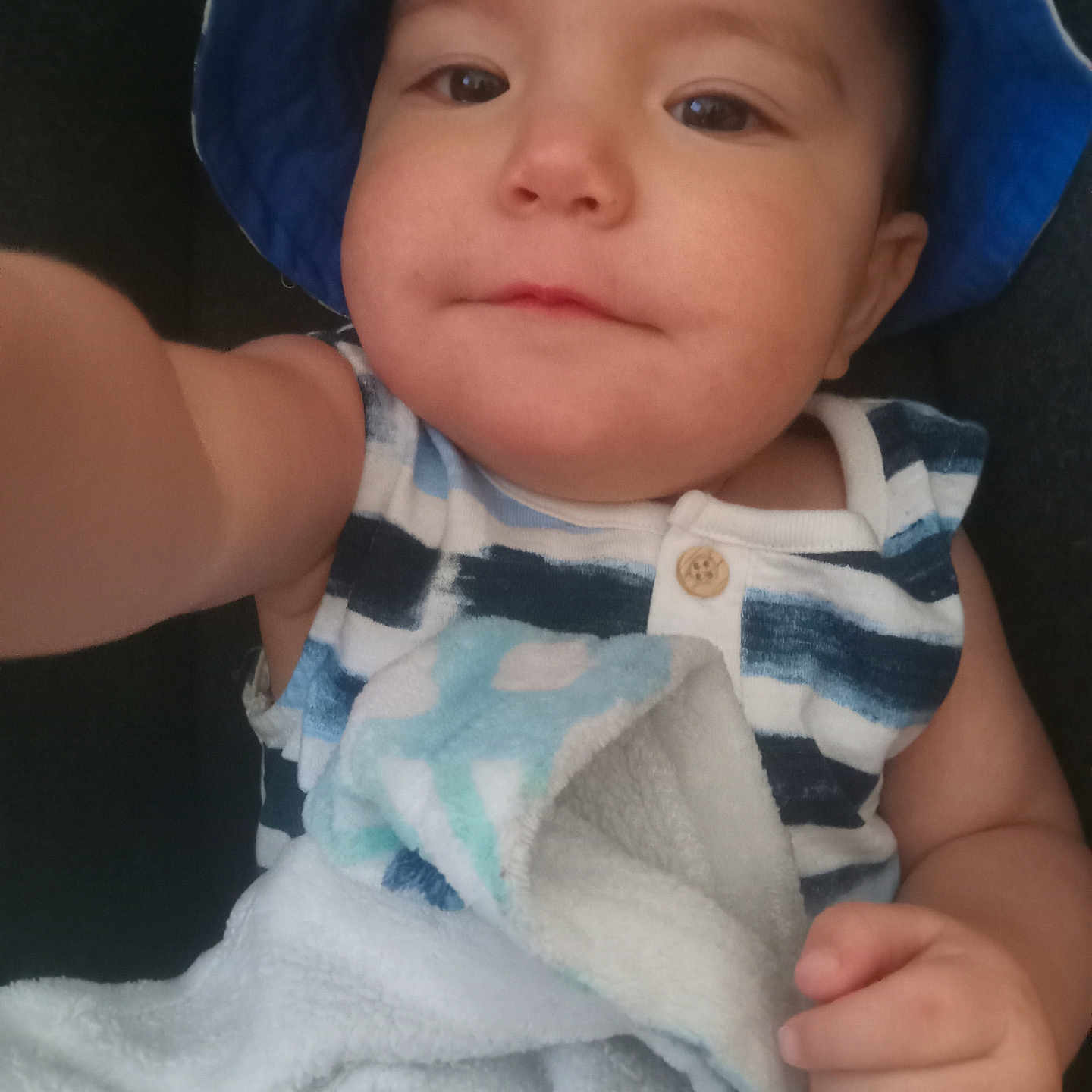 Leo is registered to the contest to win money with this photo: baby, bodypart, bonnet, cap, clothing, face, finger, hand, hat, head, hood, hoodie, knitwear, newborn, person, photography, portrait, sunhat, sweater, sweatshirt