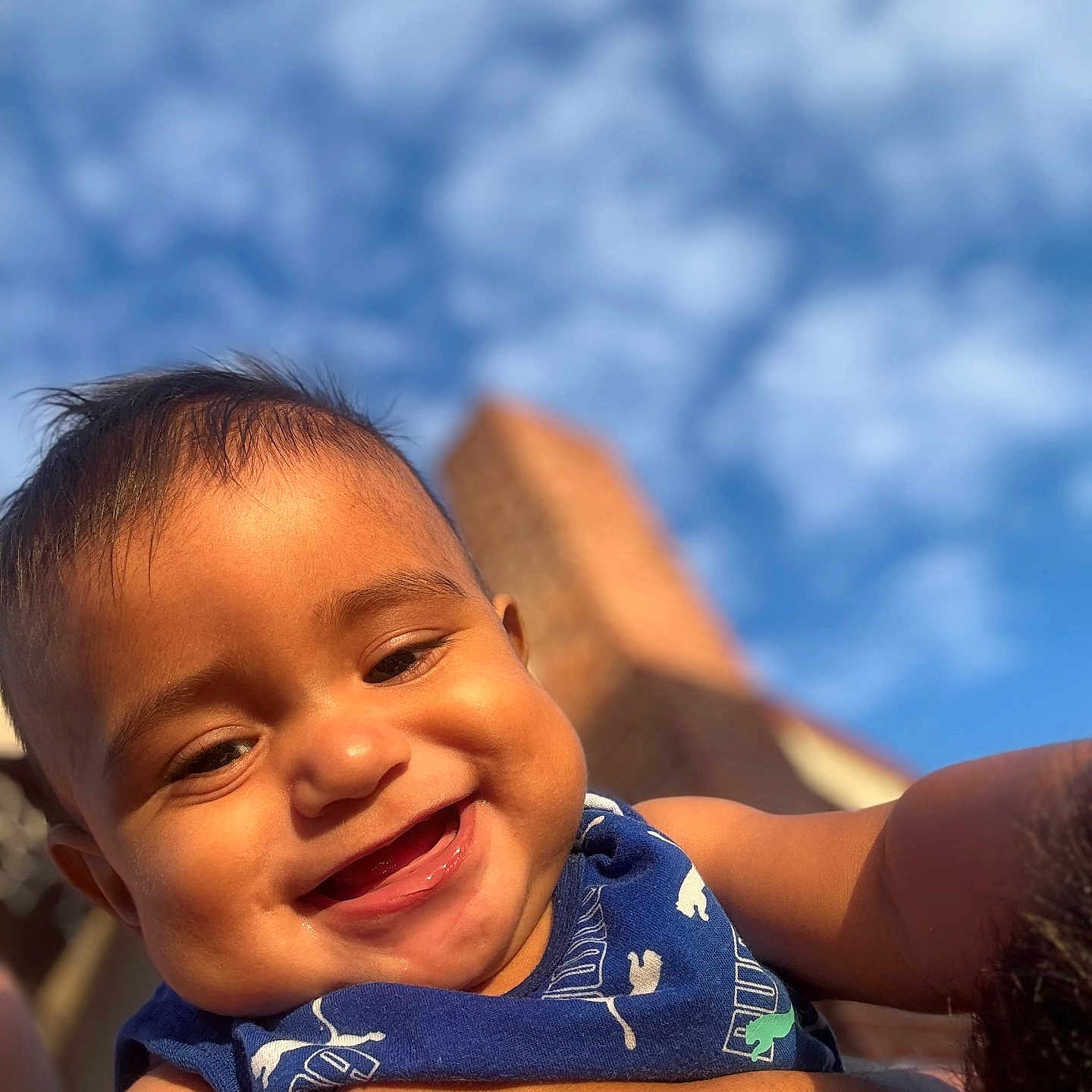 Brighton joined the competition — help win amazing prizes! arm, baby, blue_sky, cheeks, child, closeup, clouds, cute, daytime, face, happy, holding, infant, outdoor, person, portrait, skin, sleeveless, smiling, sunlight
