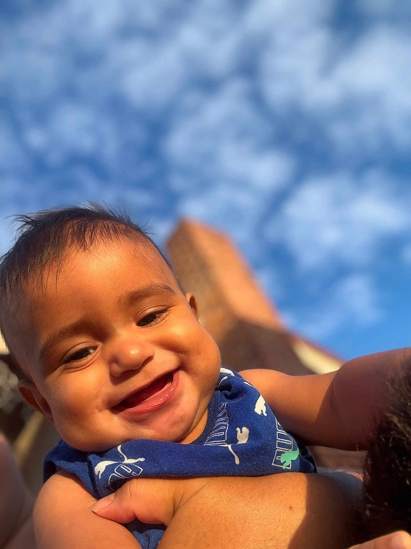 Brighton joined the competition — help win amazing prizes! baby, smiling, child, blue_sky, clouds, outdoor, portrait, happy, face, skin, sleeveless, person, closeup, sunlight, cheeks, arm, holding, infant, cute, daytime