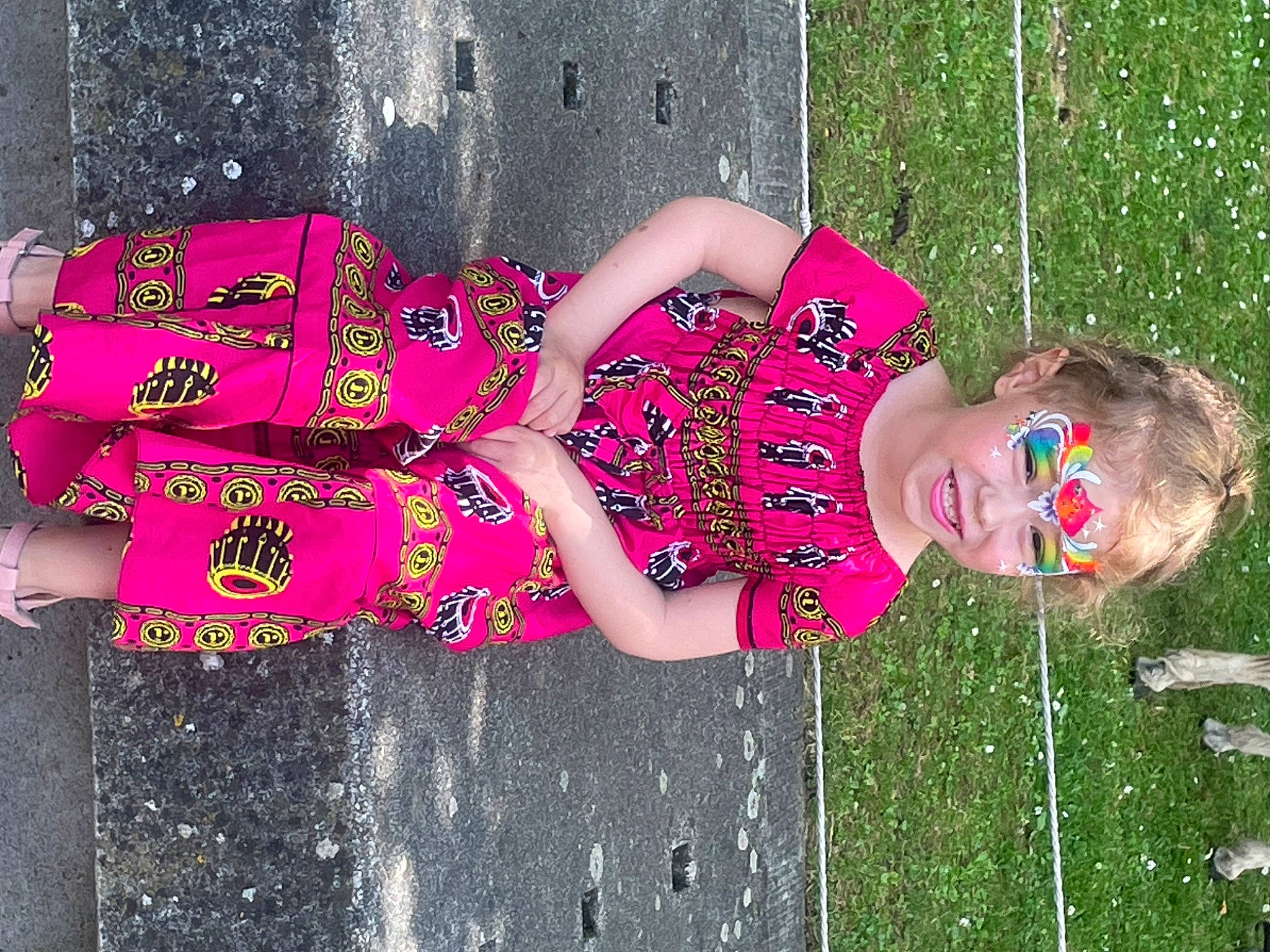 Athena participe au concours pour gagner de l'argent avec cette photo : child, event, fun, grass, green, happy, human_leg, joy, leisure, magenta, pattern, people_in_nature, person, pink, play, recreation, sandal, smile, spring, thigh