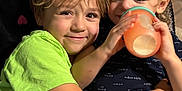 Julian is registered to the contest to win money with this photo: child, children, toddler, sibling, hugging, smiling, blanket, sippy_cup, indoor, candid, cute, love, family, portrait, happy, cozy, colorful, clothing, face, hair