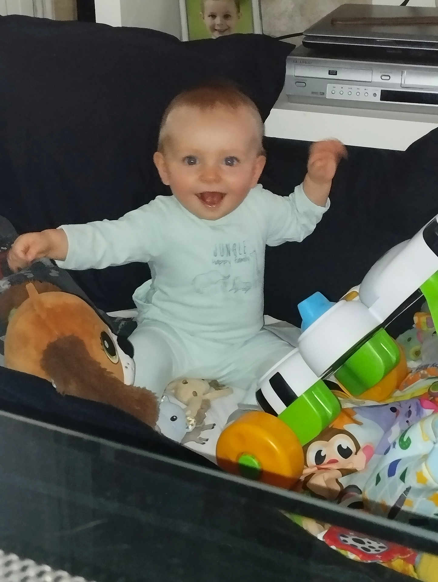 Malone participe au concours pour gagner de l'argent avec cette photo : baby, child, toy, plush_toy, indoor, smiling, pajamas, happy, sitting, infant, colorful, person, face, cute, playtime, furniture, home, cushion, photography, young