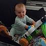 Malone participe au concours pour gagner de l'argent avec cette photo : baby, blanket, child, colorful, couch, face, furniture, happy, home, indoor, infant, pajamas, person, photograph, piano, playing, plush_toy, smiling, soft_light, toy