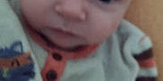 Malone participe au concours pour gagner de l'argent avec cette photo : animal_design, baby, blurred, child, closeup, clothing, cute, expression, eyes, face, head, indoor, infant, person, portrait, soft, striped_sleeves, sweater, warm_colors, young