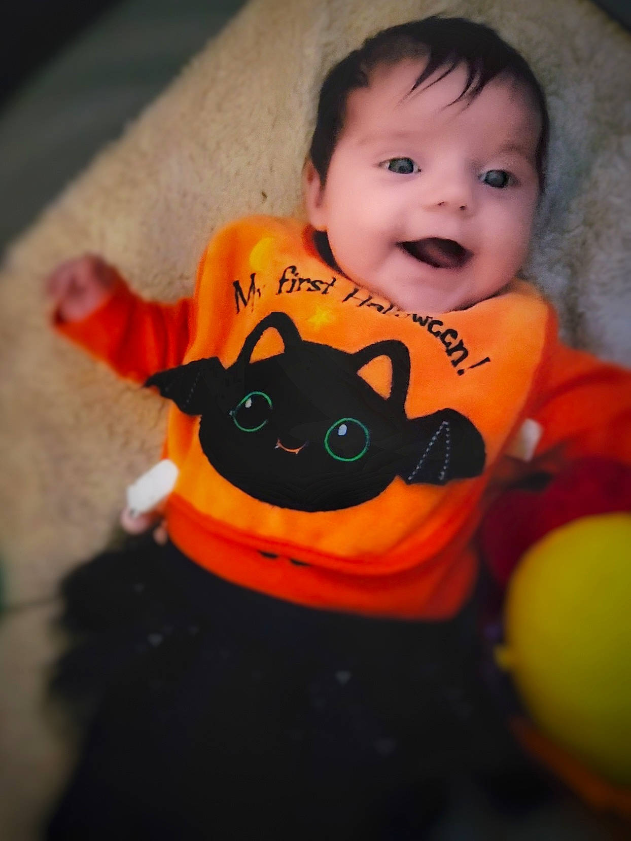 Maelyn is registered to the contest to win money with this photo: arm, baby_toddler_clothing, eye, facial_expression, felidae, finger, hand, happy, head, headgear, human_body, iris, lip, mouth, nose, orange, person, skin, smile, textile