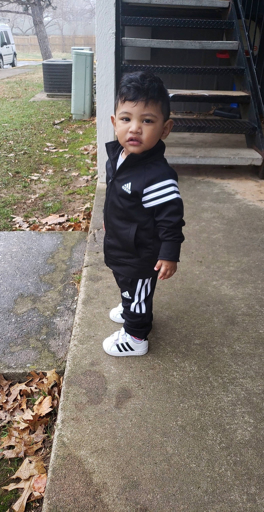 Ian is registered to the contest to win money with this photo: child, person, shoe, smile, standing, t_shirt, toddler