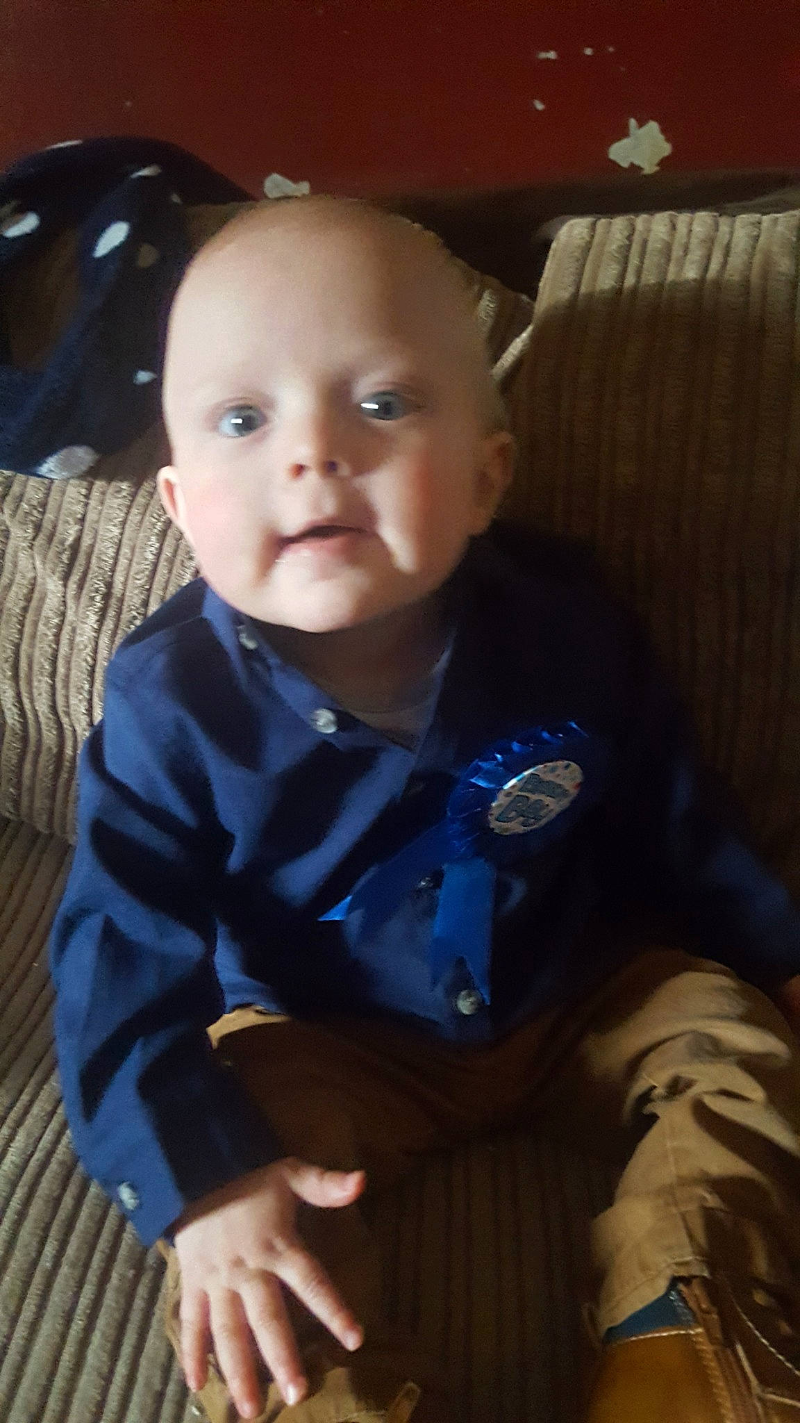 Tyler is registered to the contest to win money with this photo: baby, cheek, child, eye, face, head, male, nose, person, play, sitting, skin, smile, toddler