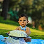 baby, child, blue_bow_tie, cake, cream, frosting, outdoor, grass, blanket, cute, face, food, sitting, young_child, portrait, nature, summer, expression, celebration, fun