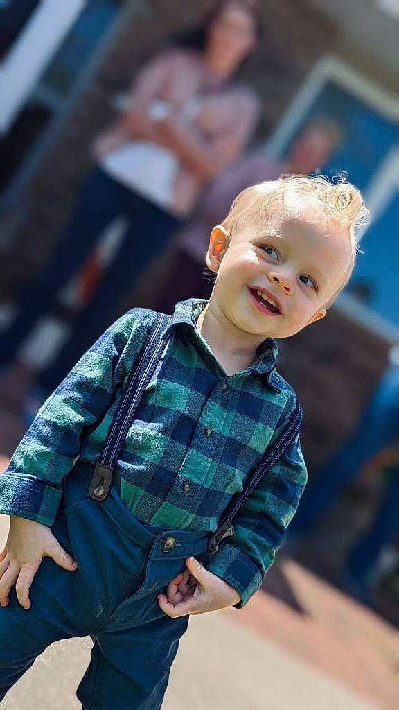 Graham is registered to the contest to win money with this photo: child, cool, denim, dress_shirt, electric_blue, fashion, flash_photography, fun, hairstyle, happy, joy, leisure, pattern, person, plaid, sitting, skin, sleeve, smile, street_fashion