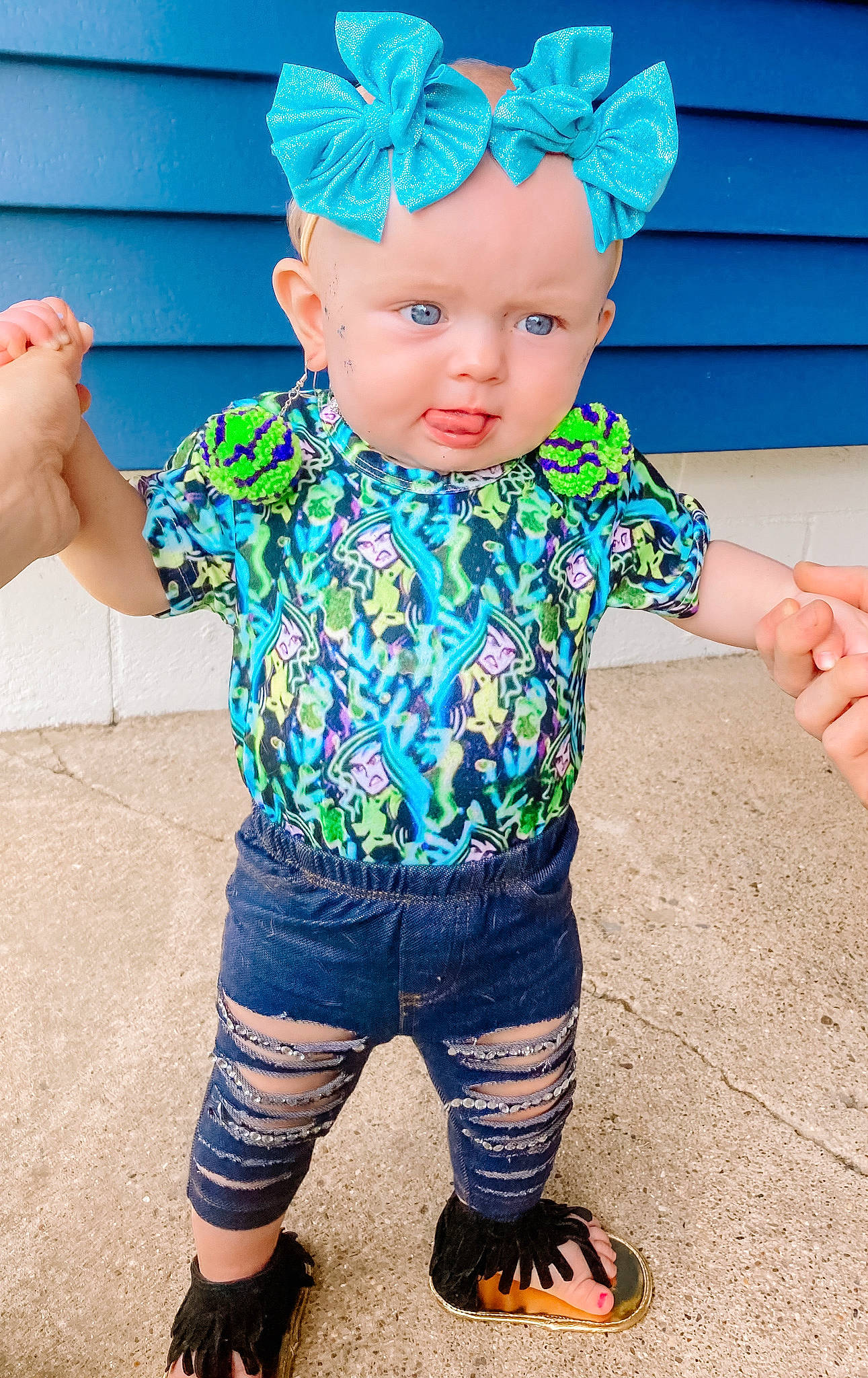 Ember is registered to the contest to win money with this photo: baby_toddler_clothing, blue, cap, child, costume_hat, electric_blue, facial_expression, finger, fun, gesture, hand, happy, head, headwear, leg, neck, pattern, person, pink, sleeve