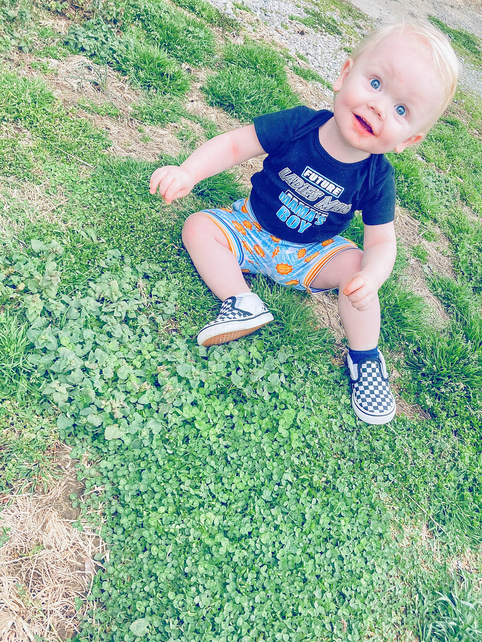 Brodie is registered to the contest to win money with this photo: baby, baby_toddler_clothing, flooring, footwear, fun, grass, grassland, green, groundcover, happy, knee, leg, leisure, meadow, people_in_nature, person, plant, shorts, smile, surprise