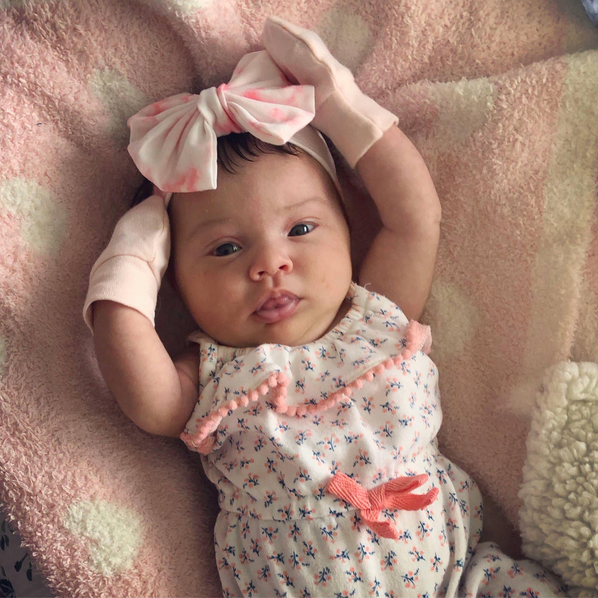 Emry is registered to the contest to win money with this photo: baby, baby_toddler_clothing, cap, cheek, collar, comfort, eye, eyebrow, face, happy, head, headwear, iris, lip, neck, nose, person, pink, skin, sleeve