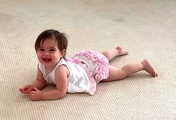 Skylar joined the competition — help win amazing prizes! baby, baby_toddler_clothing, barefoot, child, comfort, flooring, foot, grass, happy, human_body, joy, leg, pattern, person, sitting, skin, sleeve, smile, sock, t_shirt