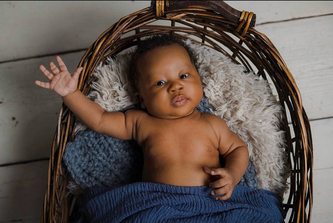 Aiko joined the competition — help win amazing prizes! baby, baby_products, basket, chest, child, comfort, eye, eyelash, fashion_accessory, flash_photography, hair, happy, head, iris, linens, metal, person, room, textile, toddler