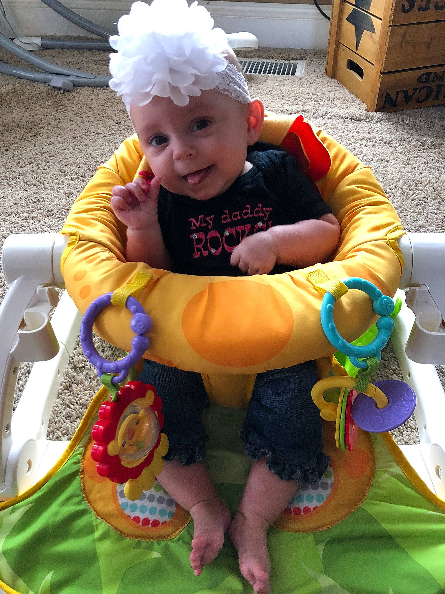 Ellianna is registered to the contest to win money with this photo: baby, baby_toddler_clothing, cabinetry, chair, child, event, fun, grass, happy, headwear, lap, leisure, person, photograph, recreation, shipping_box, shorts, smile, tire, toddler