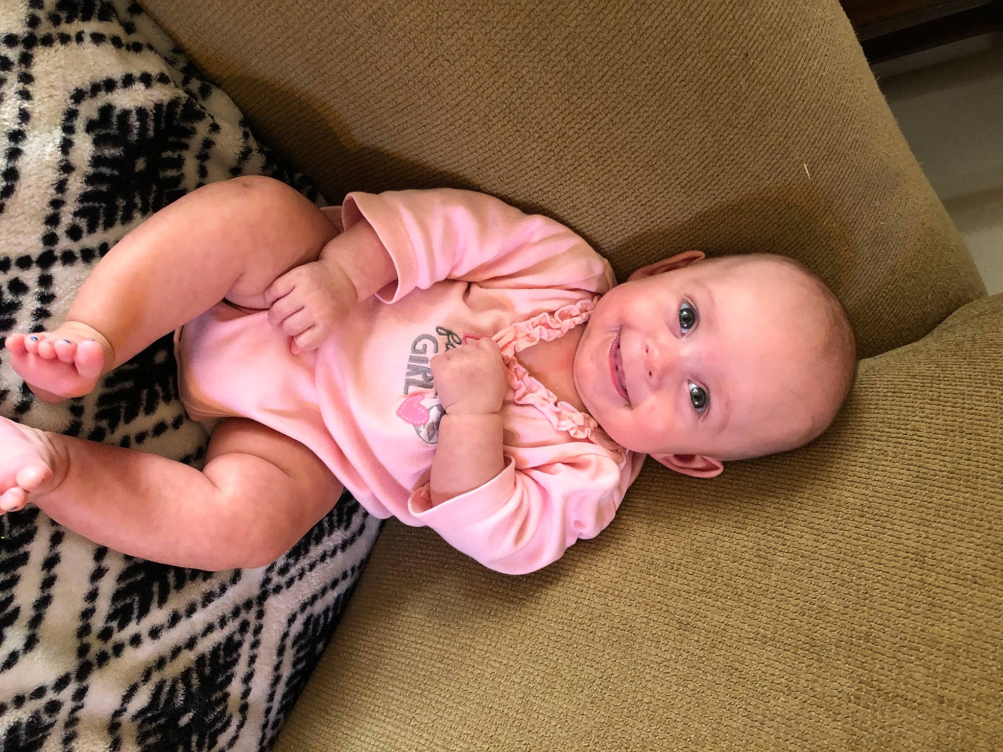 Ellianna is registered to the contest to win money with this photo: baby, baby_toddler_clothing, cheek, child, comfort, eye, face, finger, head, human_body, joy, leg, linens, nail, person, pink, product, skin, sleeve, textile