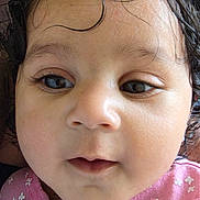 Aaira joined the competition — help win amazing prizes! baby, face, close_up, curly_hair, pink_clothing, child, portrait, young_child, cute, innocence, expression, skin, eyelashes, small_earring, natural_light, indoors, person, looking, head, childhood
