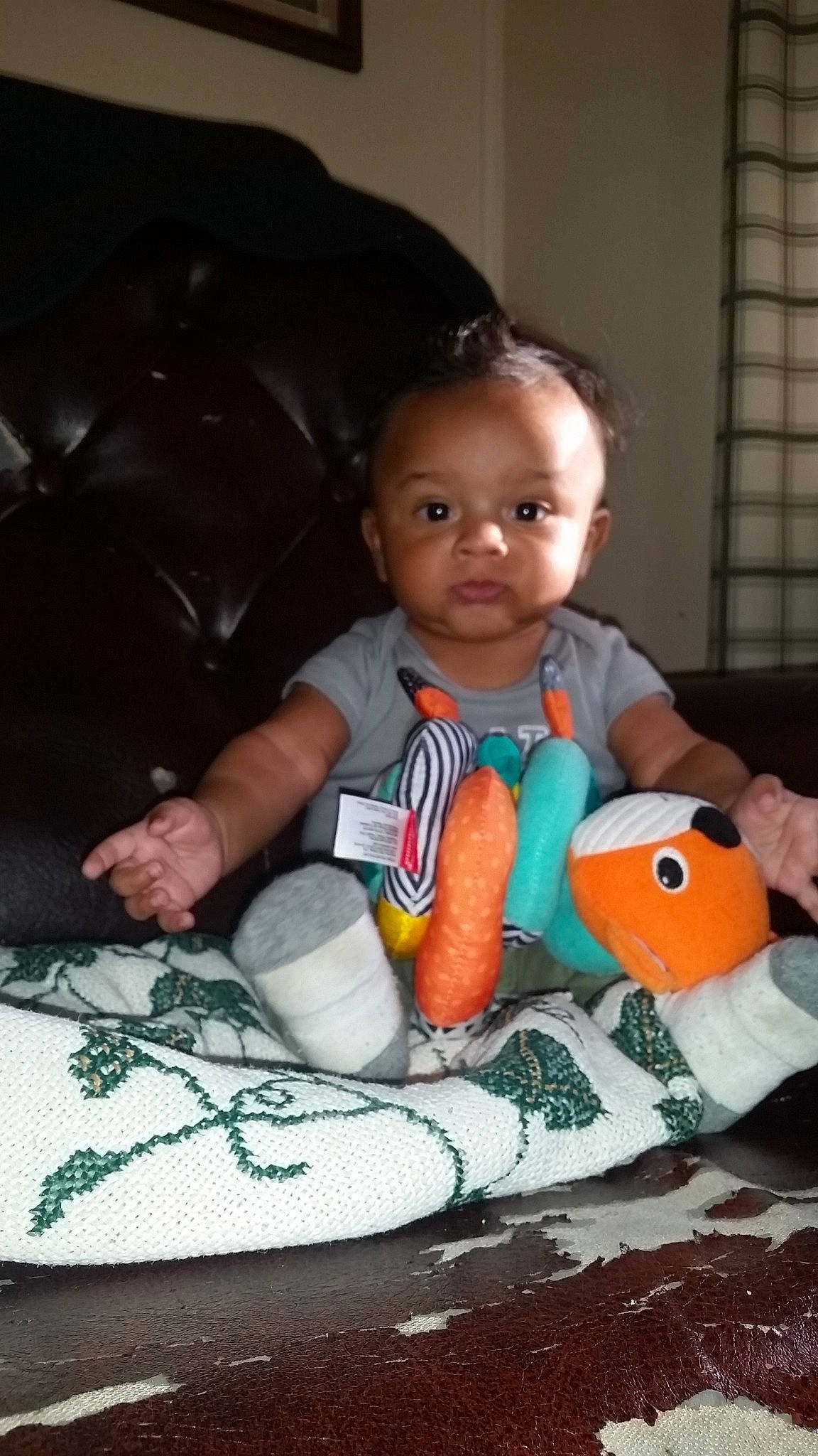 Jared  is registered to the contest to win money with this photo: baby, baby_products, baby_toys, child, person, play, sitting, smile, toddler, toy, tummy_time