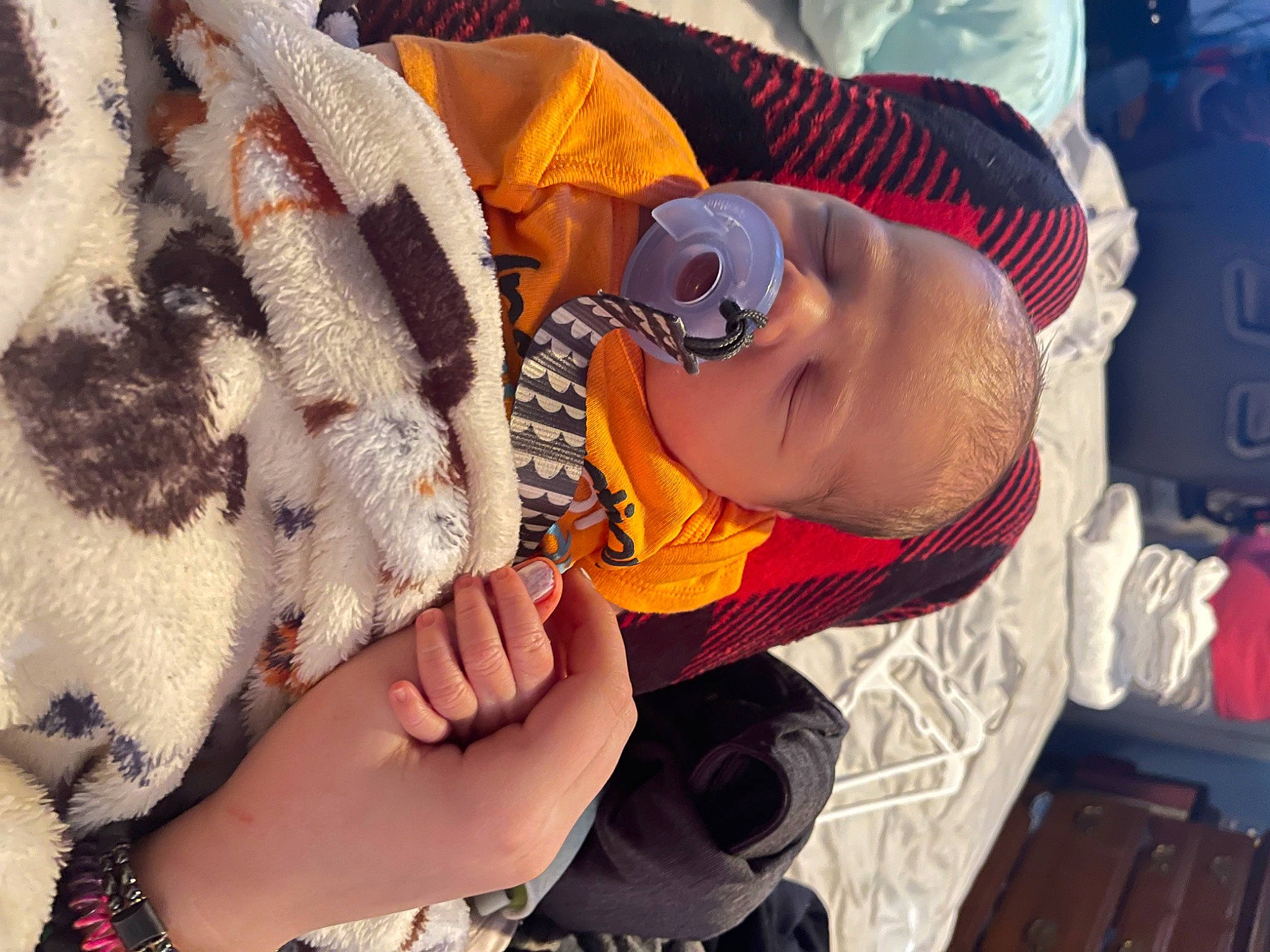 Carson is registered to the contest to win money with this photo: baby, baby_products, cap, child, comfort, eyewear, finger, glasses, goggles, hat, headgear, linens, mammal, mouth, nail, pattern, person, skin, sunglasses, toddler