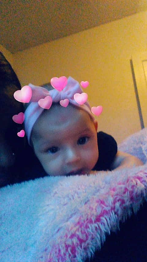 Za'Niyah is registered to the contest to win money with this photo: cheek, child, ear, eye, face, forehead, fun, girl, hair_accessory, head, headband, headgear, headpiece, infant, nose, person, pink, product, skin, textile