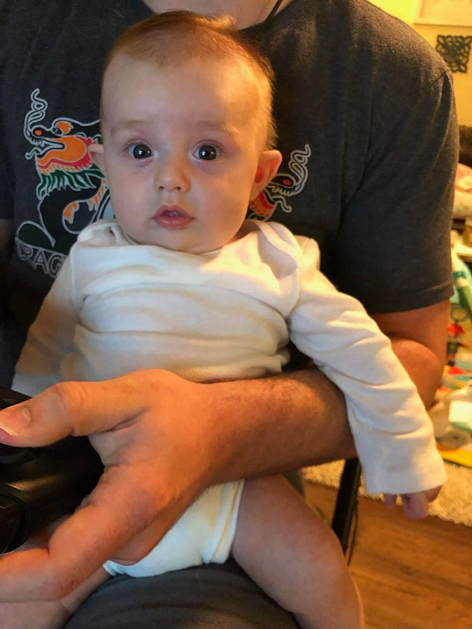 Ciara joined the competition — help win amazing prizes! arm, baby, cheek, child, finger, lap, leg, person, sitting, skin, smile, toddler