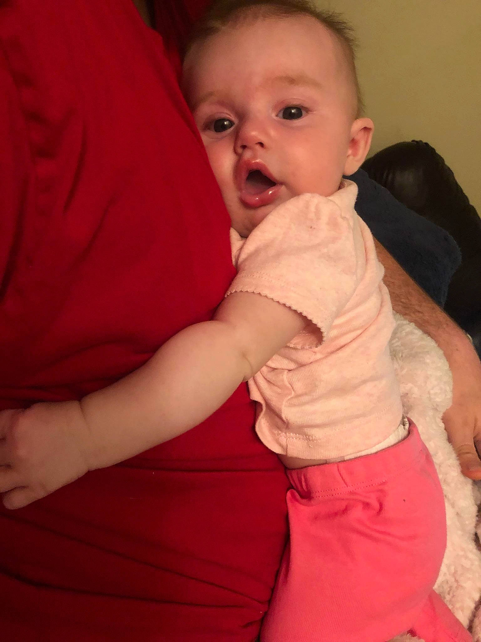 Ciara is registered to the contest to win money with this photo: abdomen, arm, baby, cheek, child, finger, gesture, hug, lip, mouth, person, pink, red, skin, smile, toddler