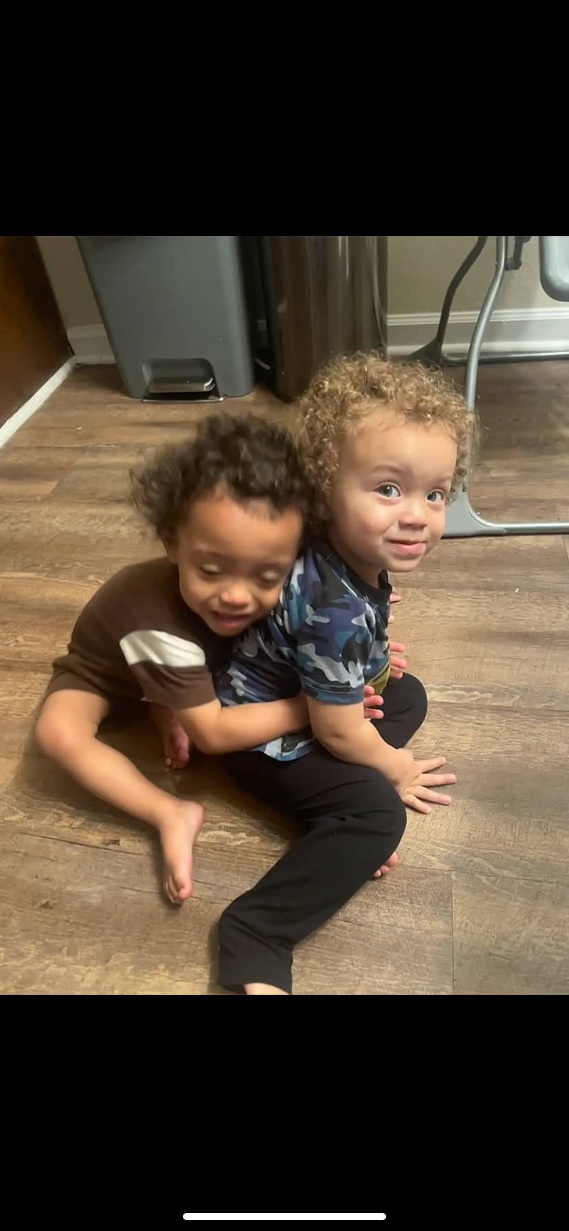 Malachi joined the competition — help win amazing prizes! baby, baby_toddler_clothing, child, face, flash_photography, floor, flooring, fun, gesture, happy, hardwood, joy, kitchen_appliance, person, play, room, sitting, smile, t_shirt, toddler