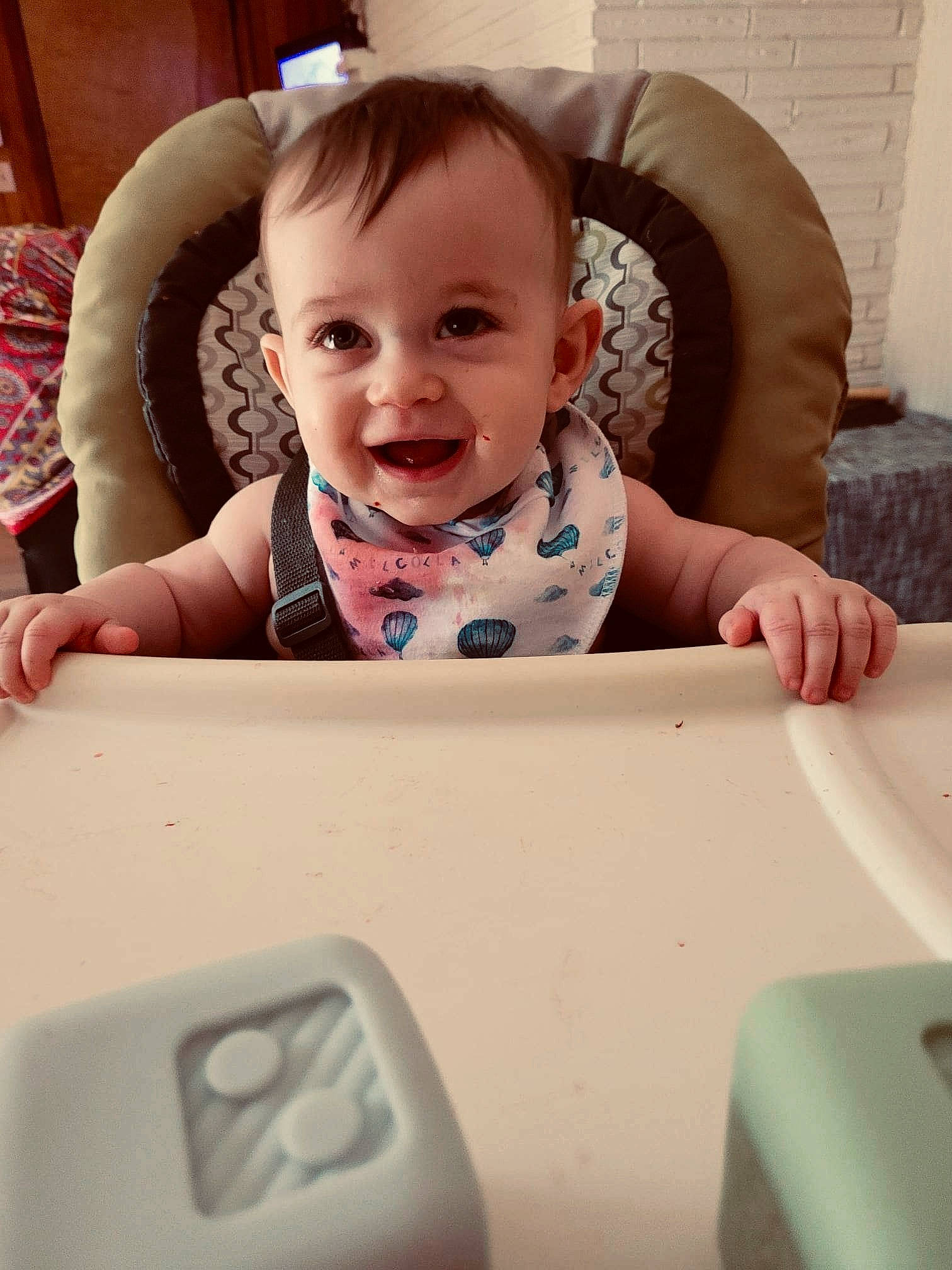 Solomon is registered to the contest to win money with this photo: baby, baby_laughing, baby_safety, baby_toddler_clothing, cheek, child, comfort, electronic_device, facial_expression, finger, happy, head, mammal, mouth, person, product, skin, sleeve, smile, technology