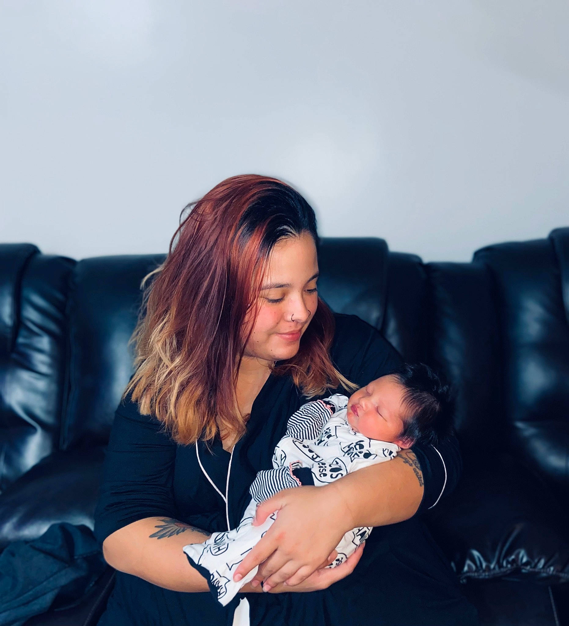 Alizae is registered to the contest to win money with this photo: baby, black_hair, comfort, cool, couch, elbow, electric_blue, facial_expression, flash_photography, fun, gesture, happy, human_body, jeans, joy, knee, lap, leg, long_hair, person