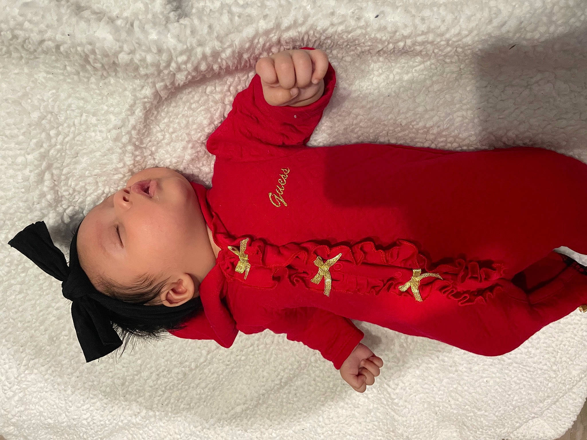 Alizae is registered to the contest to win money with this photo: arm, baby, baby_sleeping, baby_toddler_clothing, carmine, child, comfort, face, head, human_body, linens, magenta, person, pink, product, room, skin, sleeve, sock, textile