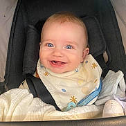 Enzo joined the competition — help win amazing prizes! baby, smiling, blue_eyes, stroller, bib, blanket, toy, infant, happy, cute, child, seatbelt, clothing, indoor, face, head, person, comfort, young, portrait