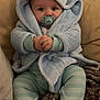 baby, blanket, blue_robe, child, comfort, couch, cozy, cute, hands_clasped, home, hooded_robes, indoor, infant, pacifier, portrait, sitting, soft_fabric, striped_pajamas, warm, wide_eyes