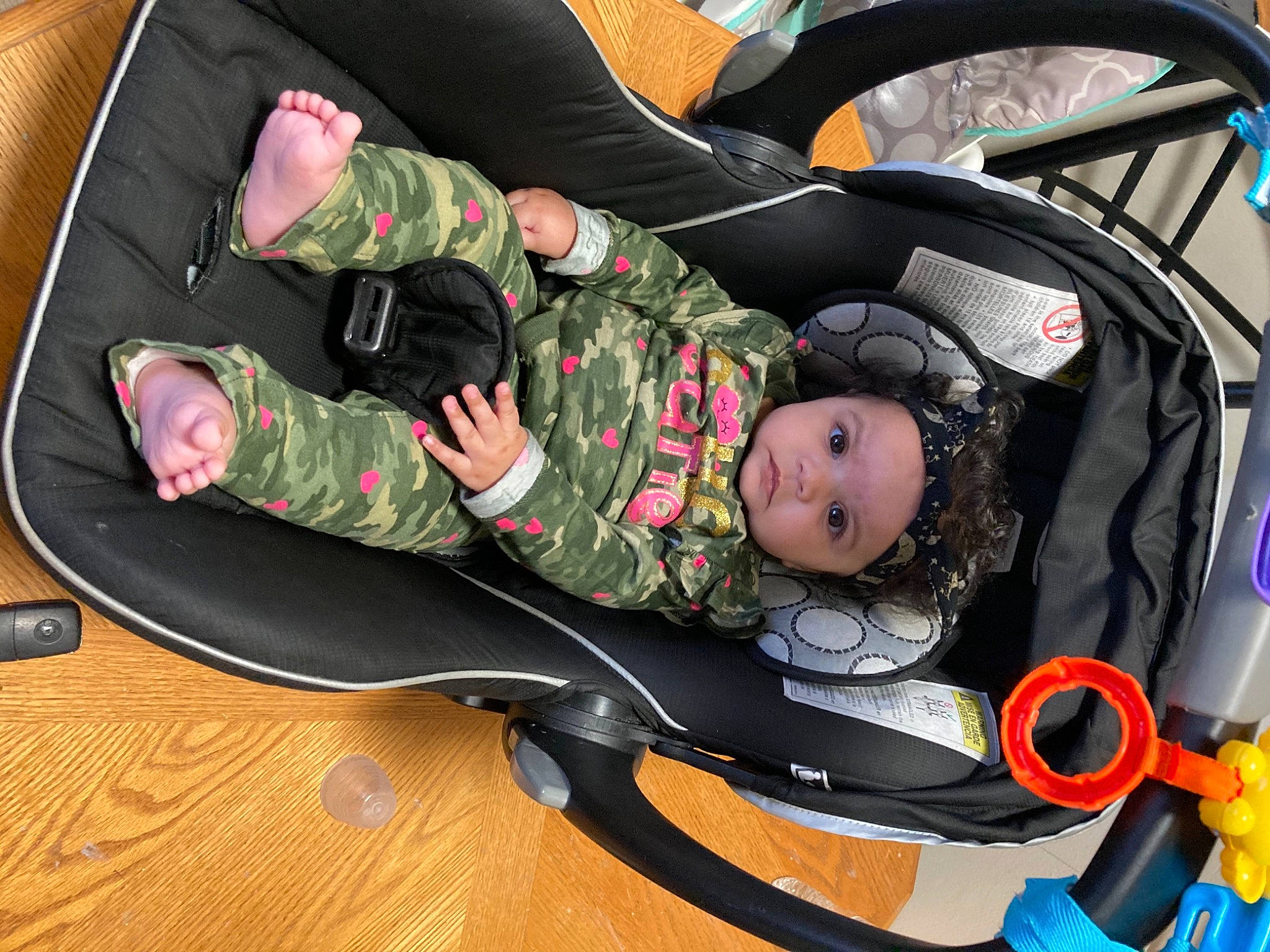 Arianna joined the competition — help win amazing prizes! auto_part, baby, baby_carriage, baby_products, baby_safety, baby_toddler_clothing, camouflage, car_seat, child, comfort, diving_mask, hardwood, headwear, lap, person, personal_protective_equipment, sitting, smile, toddler, vertebrate